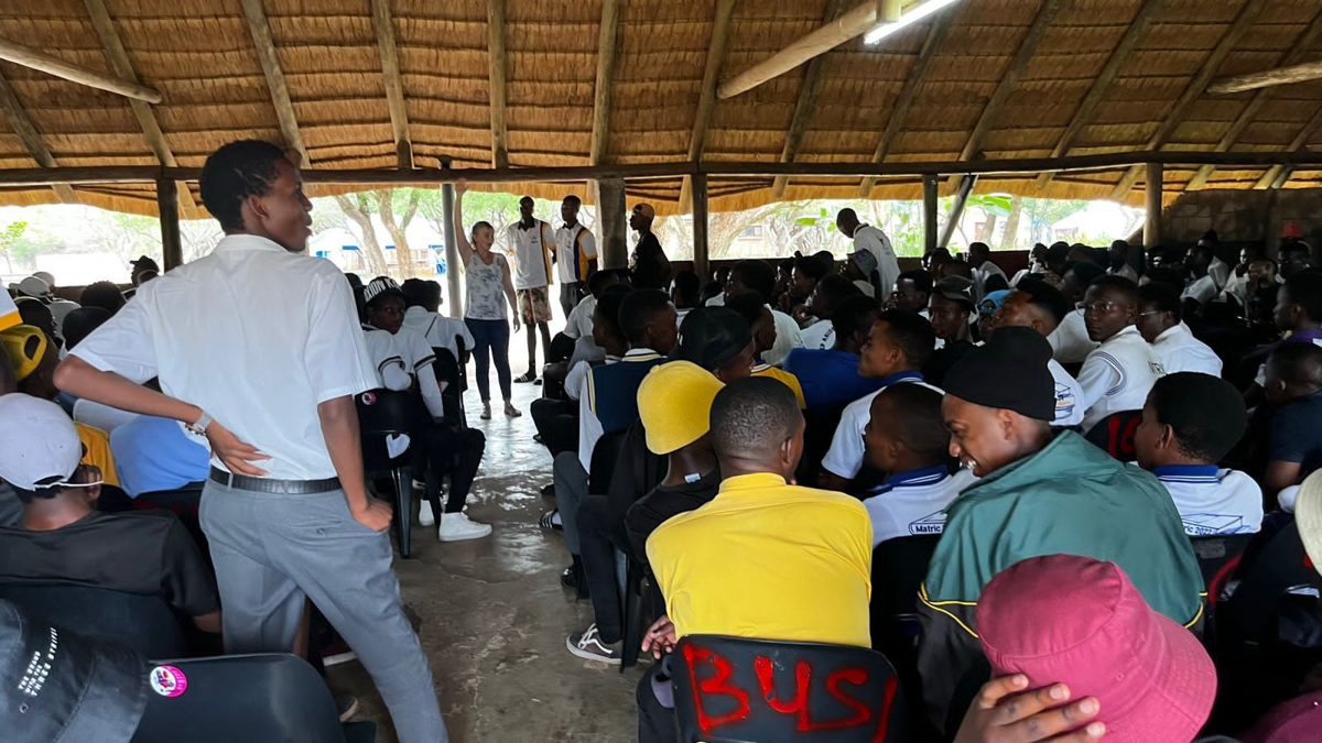 A learner addressing PROTEC learners in an open-air venue