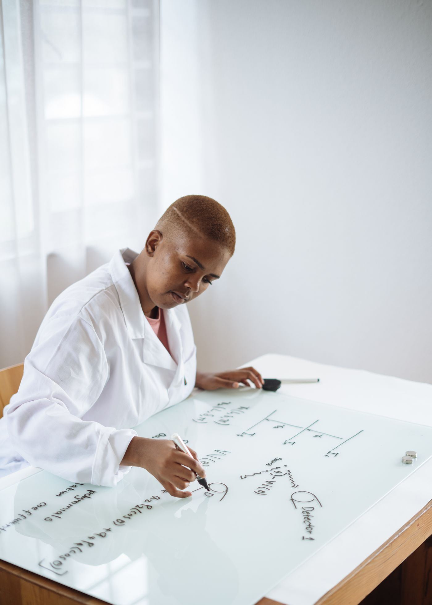 A young woman working through a science problem